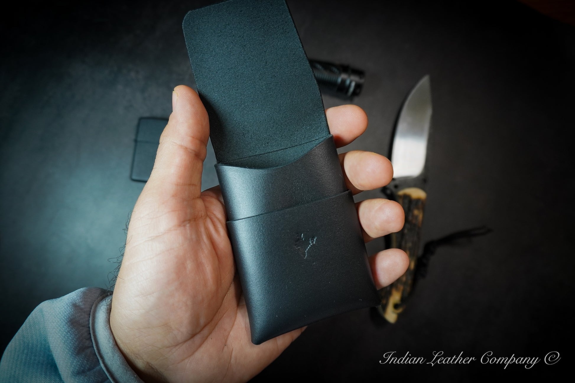 Photo showing premium handmade stitchless origami style full grain veg tanned card wallet in black