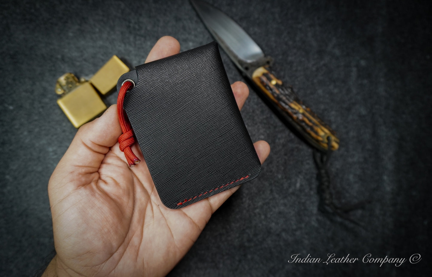 K2 wallet with stainless steel snap button and practical lanyard for everyday carry.