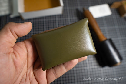 Hand holding a full grain green leather wallet from Indian Leather Company