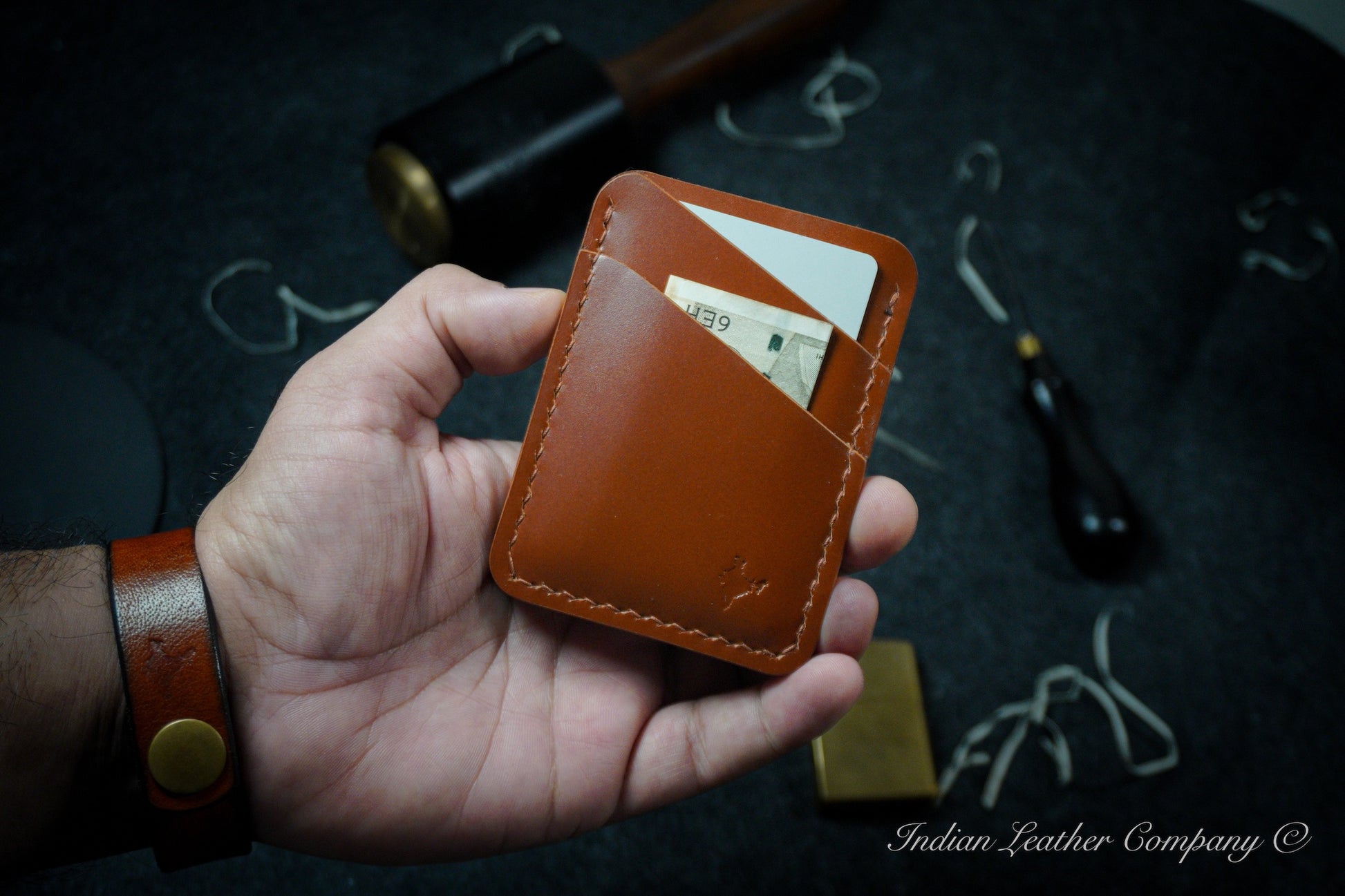 The Explorer wallet, crafted from rich tan-colored Veg tanned Italian Leather. This rugged yet refined accessory features four spacious pockets to keep your essentials organized.