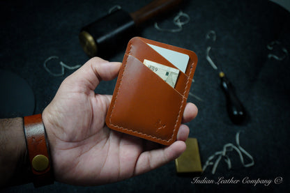 The Explorer wallet, crafted from rich tan-colored Veg tanned Italian Leather. This rugged yet refined accessory features four spacious pockets to keep your essentials organized.