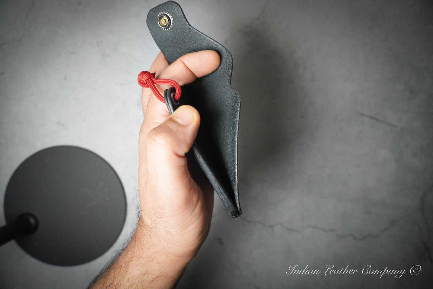 Black wallet with red stitching by Indian leather Company