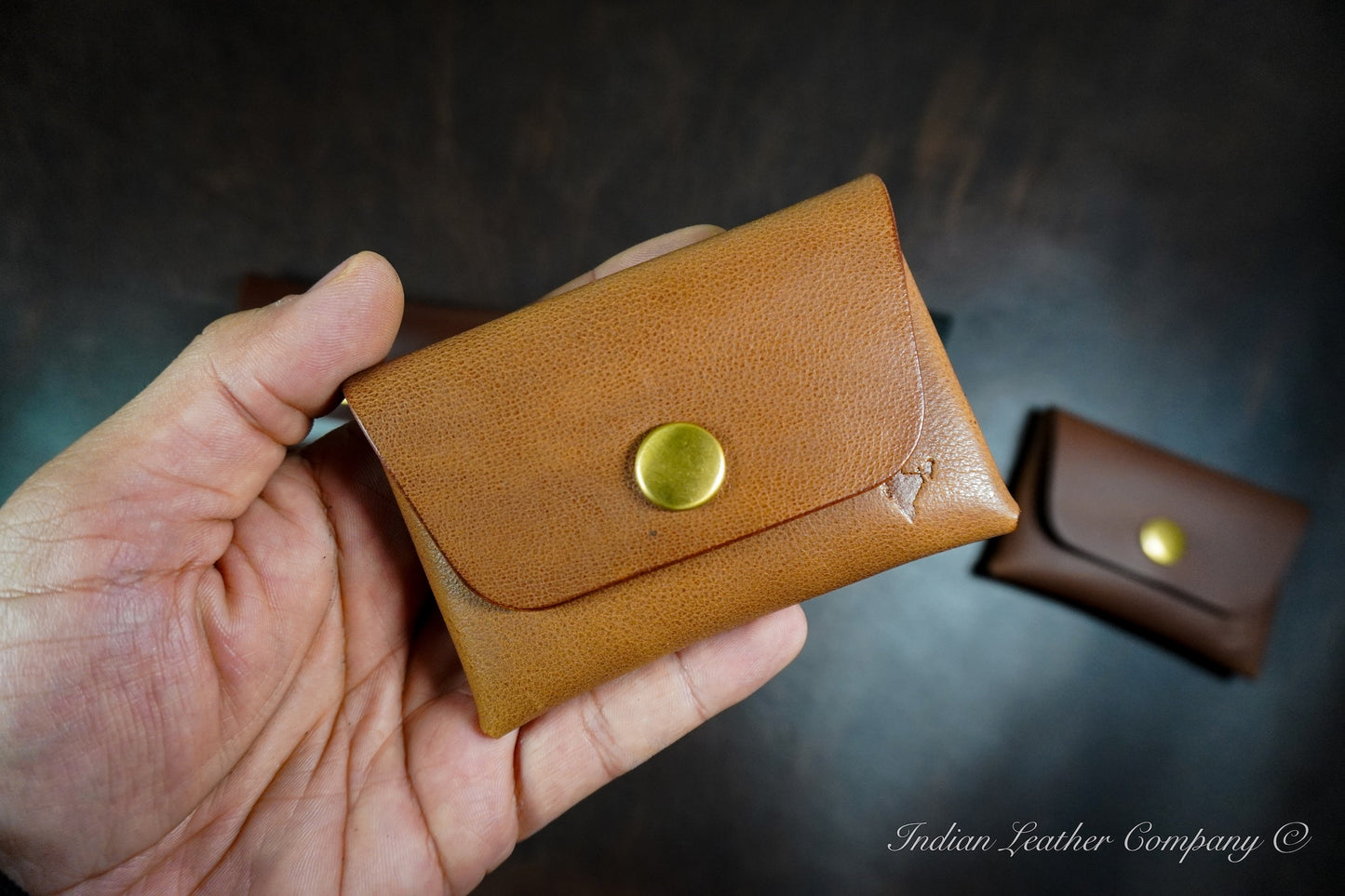 Smooth full grain calf leather stitchless wallet with snap button closure and compact design