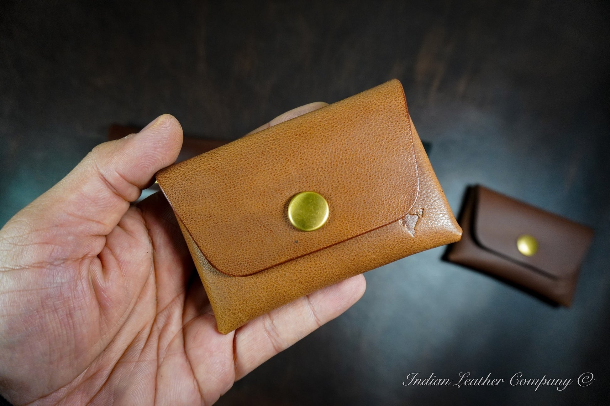 Smooth full grain calf leather stitchless wallet with snap button closure and compact design