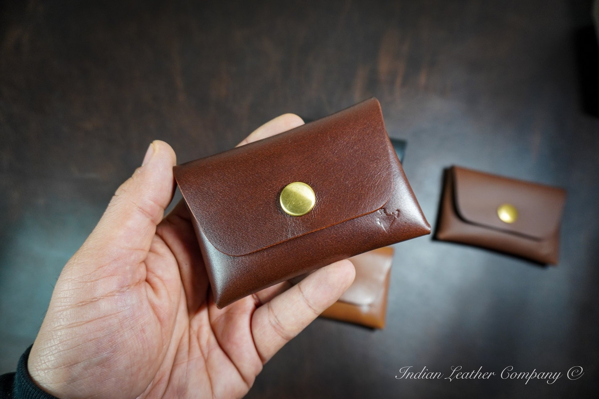 Compact Latigo brown leather snap wallet with smooth folded edges and minimal front profile for everyday carry