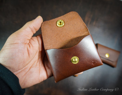 Minimalist stitchless leather wallet showing interior card pocket and folded leather construction without visible stitching