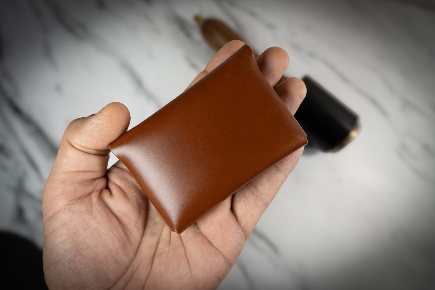 Corsair Wallet by indian leather company and ds leather goods being held in hand, illustrating its slim profile and stylish design for everyday use