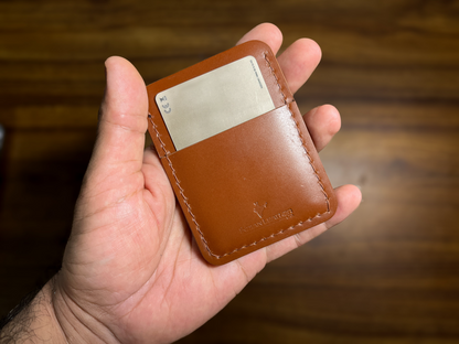 Explore the world with confidence and style using the Explorer wallet, crafted from rich tan-colored Veg tanned Italian Leather. This rugged yet refined accessory features four spacious pockets to keep your essentials organized, making it perfect for both outdoor enthusiasts and those who appreciate a touch of sophistication in their everyday carry